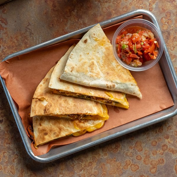 Oink And Moo BBQ quesadillas with melted cheese and meat, served with a side of salsa.